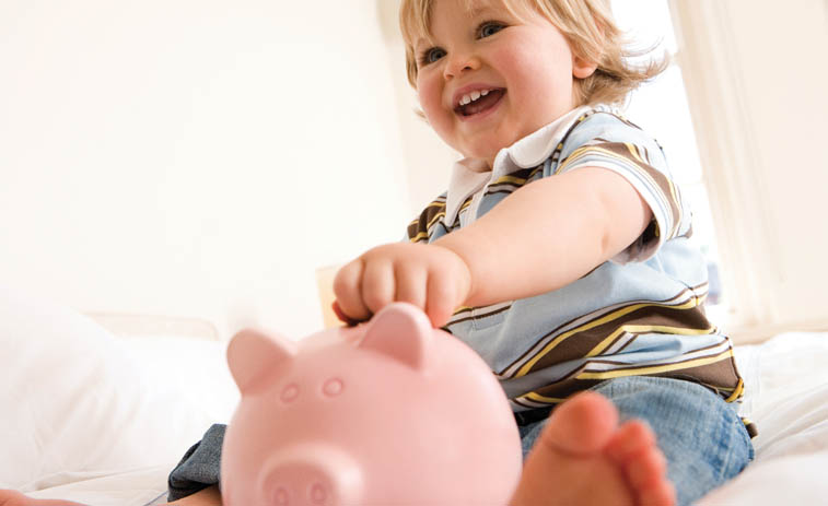 Financing your Home Comfort Solution - smiling boy with piggy bank